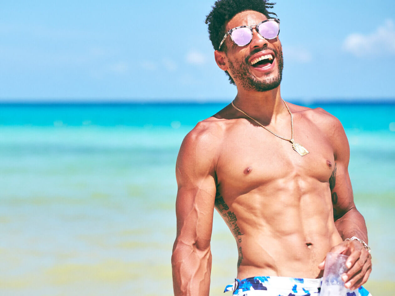 Lifestyle Photography Men - Sunglasses laughing on the beach - Playa del Carmen, Mexico - Model Poses - Marquis - Fuji X Pro2 with xf 56mm f1.2