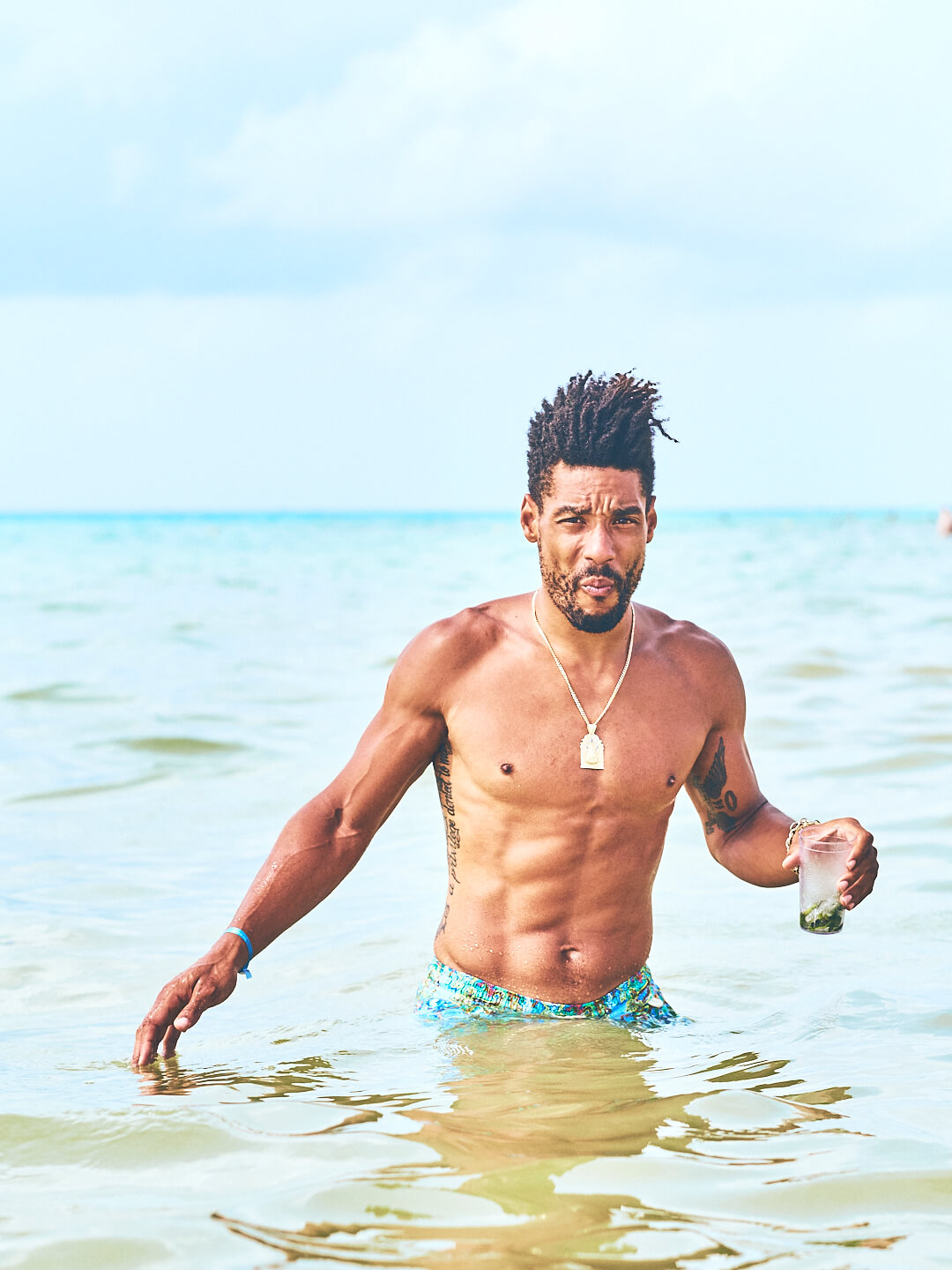 Fuji X Pro2 with xf 56mm f1.2 - Model in water drinking a beverage. Playa del Carmen, Mexico - Model: Marquis