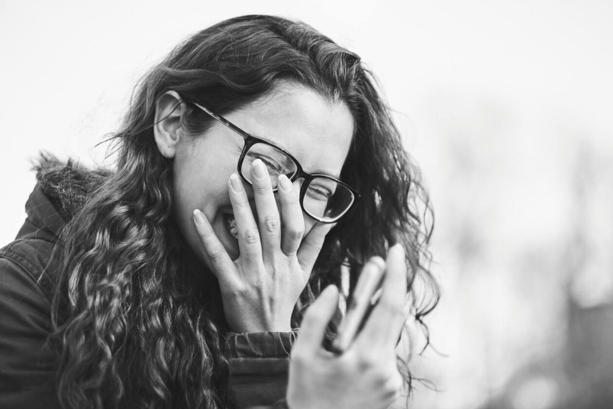 Fuji X Pro2 with xf 56mm f1.2 - Black and White Portrait Photography in Brooklyn New York around Prospect Part. Woman with glasses laughing- Model: Andrea