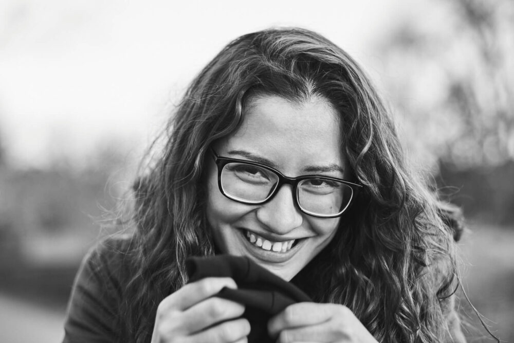 Fuji X Pro2 with xf 56mm f1.2 - Black and White Portrait Photography in Brooklyn New York around Prospect Part. Woman with glasses and a smile - Model: Andrea