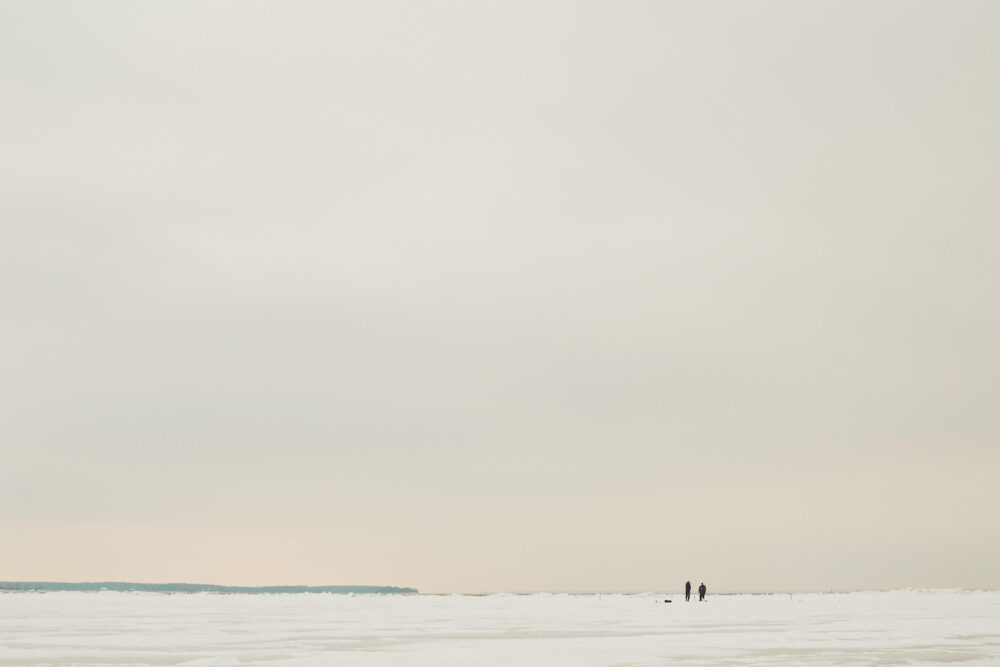 Canon 5D Mark iii with ef 50mm 1.8 - Landscape Photography - Two people walking on a frozen river at Rene Levesque Park Montreal Quebec