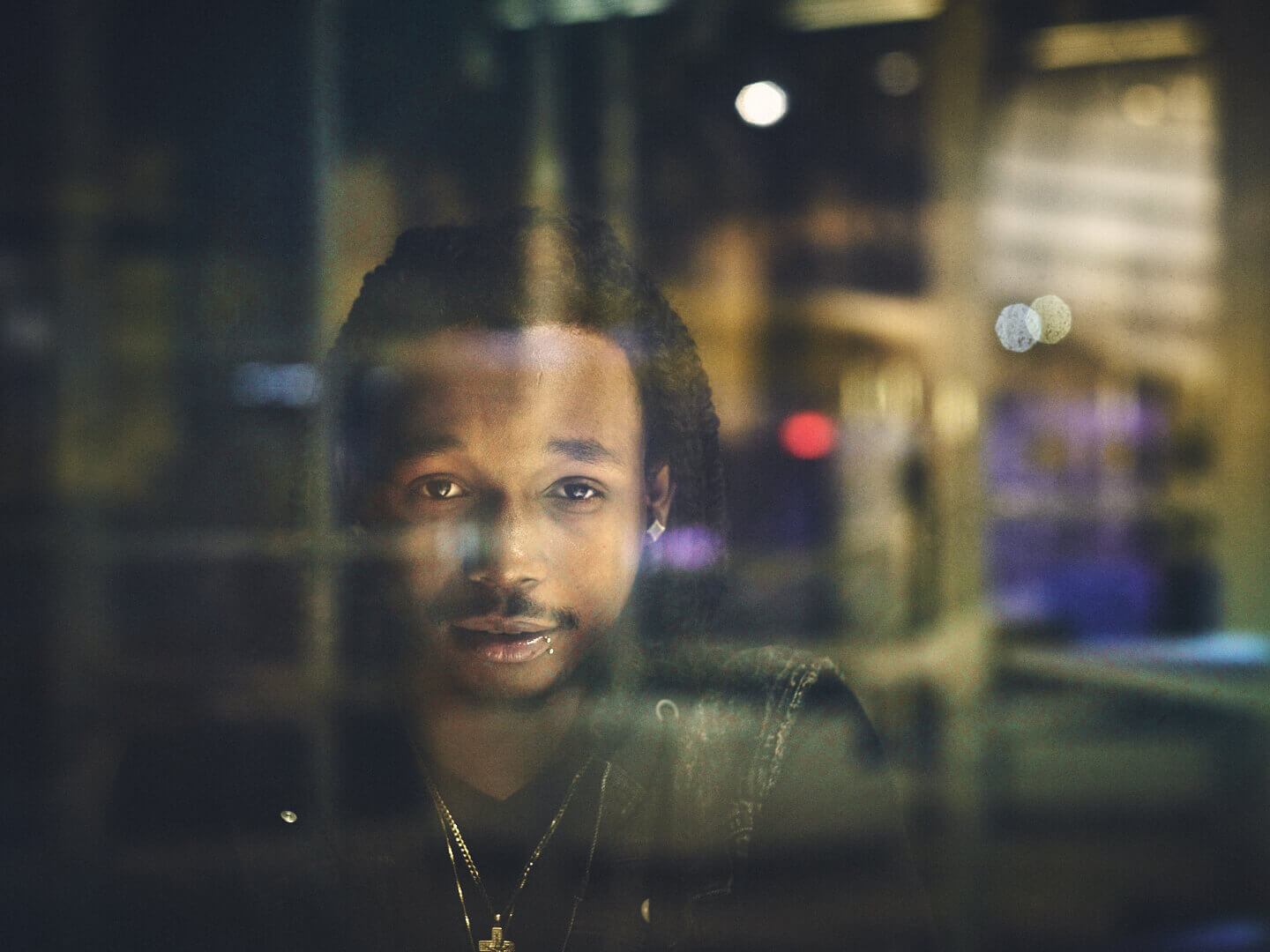 Fuji X Pro2 with xf 56mm f1.2 - New York portrait photography shot through window - Model: Idris