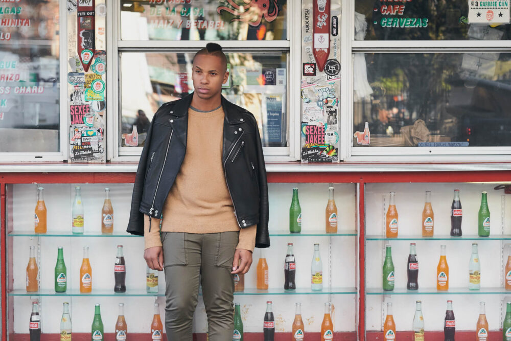 Fuji X Pro2 with xf 56mm f1.2 - Frank and Oak Men's Fashion Photography in SoHo New York with male standing next to restaurant store front - Model: Rashad