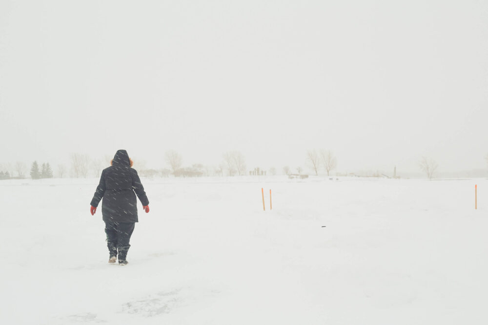 Canon 5D Mark iii with ef 50mm 1.8 - Landscape Photography - Person walking on a frozen river at Rene Levesque Park Montreal Quebec