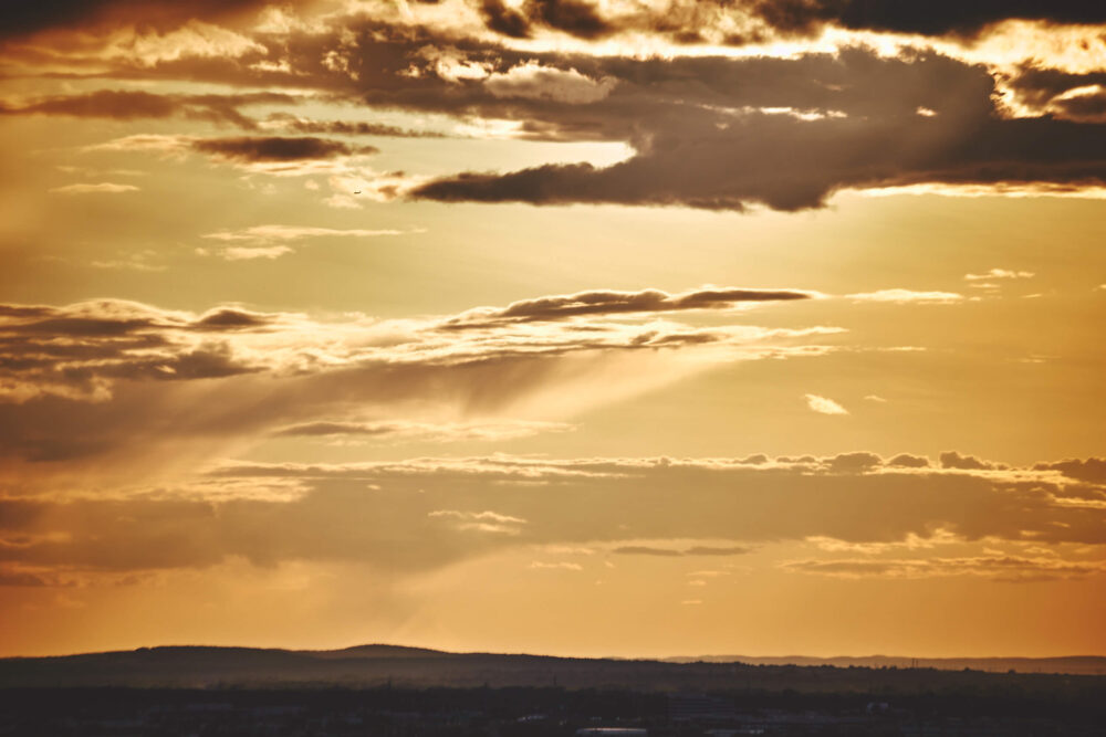 Canon 5D Mark iii with 70-300mm 4/5.6- Golden hour sunset on Balcony in Montreal with airplane in the sky