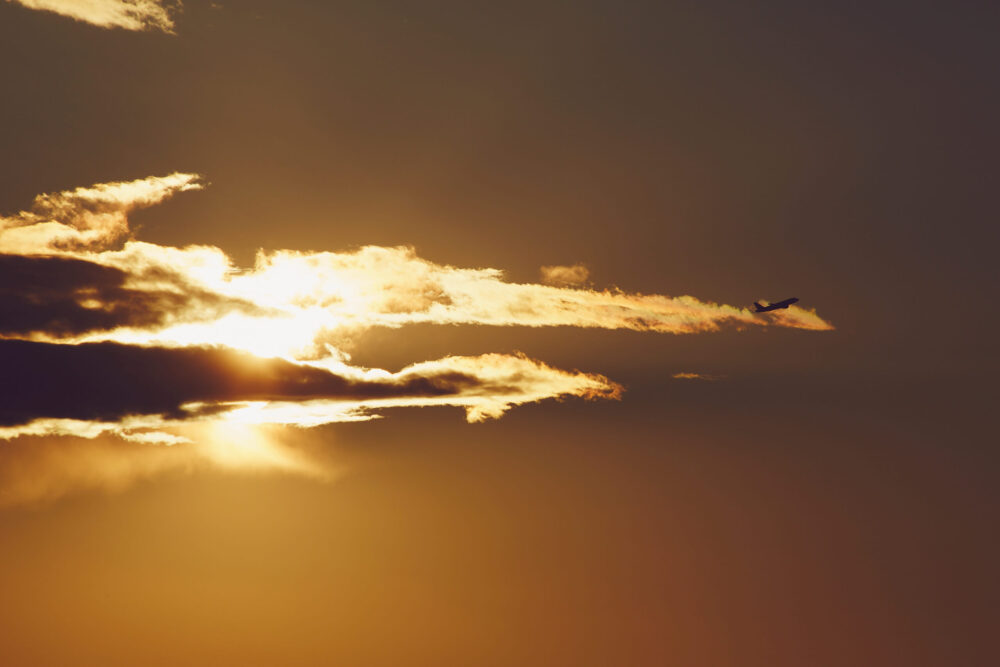 Canon 5D Mark iii with 70-300mm 4/5.6 - Golden hour sunset on Balcony in Montreal with airplane in the sky